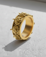 Gold vermeil skull pumpkin ring with intricate Jack-o'-lantern faces and beaded borders on white background