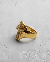 Gold vermeil silver ankh cross ring paved with clear stones on textured grey background