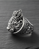 Side profile of sterling silver lion ring displaying intricate floral shank engravings and crown detail