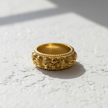 14K gold vermeil wise skulls ring featuring see hear speak no evil design with beaded edges on white surface