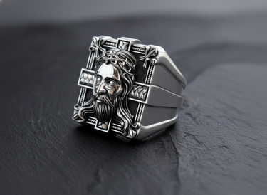 Close-up of Jesus Christ face relief on square sterling silver ring with cross background detail