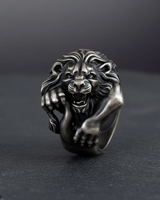 Front view of silver lion ring with fierce expression and oxidized finish highlighting the detailed craftsmanship