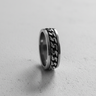 Side profile of handcrafted spinner ring showing loose chain mechanism and metal thickness