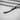 Angled view of silver Zulfiqar pendant showing double-pointed blade and intricate handle detail
