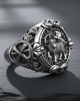 Angled perspective of the Christian signet ring, focusing on the oxidized finish and raised relief of the lamb design.