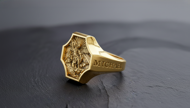Gold plated version of Archangel Michael signet ring displaying high relief sword and demon imagery on dark stone background