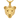 Gold vermeil lioness head pendant with detailed fur texture displayed on dark wood background