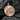 Detailed London City Pendant displaying intricate UK landmarks resting on a textured dark stone background
