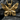 Close-up of golden butterfly pendant resting on dark textured stone highlighting the premium metalwork design