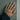 Clasped Handshake Embrace Ring, gold vermeil, worn on model hand against concrete wall
