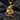 Dragon moon pendant showing majestic wings and crescent moon design resting gracefully on dark textured rocks.