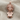Medusa Bust Pendant, rose gold, front view on textured fabric