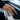 Man wearing the gold vermeil superhero emblem ring while playing the piano demonstrating lifestyle fit