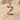 Swan Letter Z Pendant, rose gold finish, angled view on sand