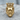 Close-up angled view of the crowned king ring resting on textured wood highlighting the detailed beard and crown.