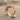 Pave Gemstone Dolphin Ring, rose gold plated, product photo on sand