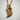 Resting Swan Pendant, gold vermeil, hanging on chain against wall