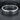 Close-up angled shot of the premium silver Sounds Gay band ring resting on a dark textured slate background