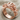 Cannabis Angel Ring, rose gold, angled view on fabric