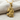 Goddess Maat Pendant, gold vermeil, product photo on fabric