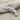 Checkered Grip Revolver Pendant, polished silver, front view on fabric