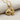 Fantail Goldfish Pendant, gold vermeil, product photo on fabric