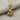 Elegant 925 silver rose pendant with lifelike leaves and blooming flower design displayed gracefully on textile