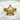 Chevron Nautical Star Ring in gold vermeil, front view on stone surface