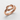 Reef Knot Ring, rose gold, angled view on textured surface