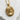 Baby girl pendant, gold vermeil finish, front view on stone