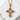 Interwoven Cross Pendant, rose gold, front view on stone