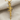 Assault Rifle Pendant, gold vermeil, front view on fabric