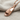 Slide Sandal Pendant, rose gold plated, angled view on fabric