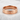 Do Kanji Ring, rose gold, front view on stone surface