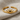 Rising Sun Ring, gold vermeil, angled view on fabric
