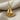 Hammered Sailboat Pendant, gold vermeil, product photo on linen