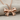 Bow Ribbon Pendant, rose gold, angled view on fabric
