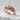 Feather Wrap Ring, rose gold, angled view on white stone