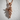 Praying Baby Angel Pendant, rose gold, angled view against wall