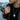 Close up of oxidized silver panda pendant wearing Asian conical hat with detailed bamboo texture