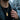 Male model wearing the masculine Hagakure samurai pendant necklace with dark leather jacket in an urban city setting