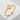 Great wave crest ring, gold vermeil, angled view on stone base