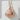 Onigiri Rice Ball Pendant, rose gold, front view on stone display