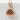 Grilled Onigiri Pendant, rose gold, front view on white concrete
