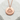 Japanese Onsen Medallion Pendant, rose gold, product display on stone