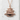 Golden Pavilion Pendant, rose gold, front view on stone