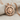 Hittite Sun Disk Pendant, rose plated silver, textured fabric product photo