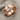 Teshub lightning ring, rose gold finish, studio view on linen surface