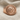 Lydian Lion Coin Ring, rose gold finish, angled view on fabric