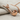 Tobacco Pipe Pendant, rose gold, side profile view on fabric